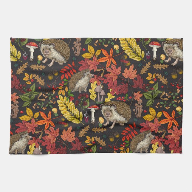 Hedgehogs and autumn forest flora on black kitchen towel (Horizontal)