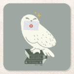 Hedwig With Letter Whimsical Drawing Square Paper Coaster<br><div class="desc">Deliver a little magic with this charming Hedwig illustration inspired by the wizarding world. Perched atop a stack of spellbinding textbooks labeled Potions and Herbology, Hedwig proudly holds a sealed Hogwarts™ letter. The soft, minimalist style and muted tones give this design a cozy, storybook feel, while subtle sparkling accents add...</div>