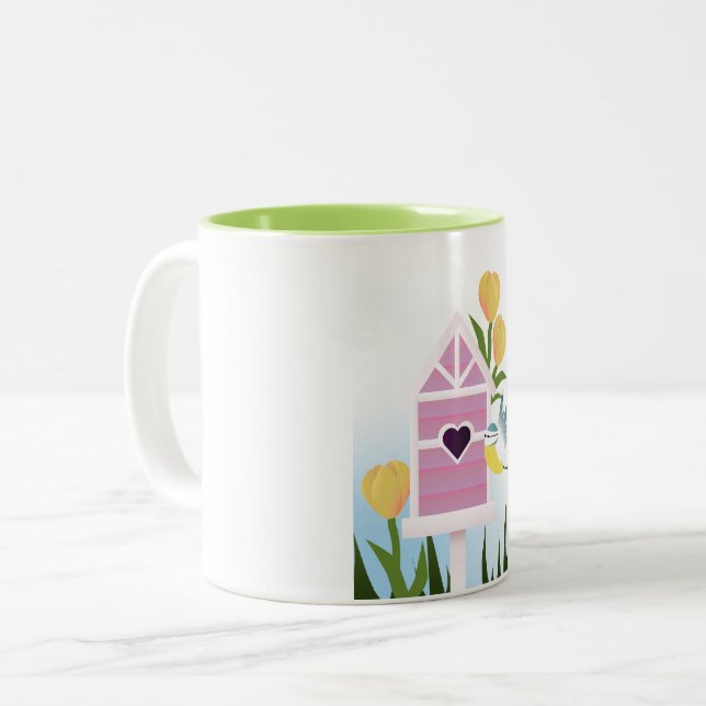 Hello Spring – Pastel Birdhouse and Yellow Tulips Two-Tone Coffee Mug (Front Left)