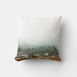 HERD OF SHEEP ON BROWN GRASS FIELD DURING DAYTIME THROW PILLOW