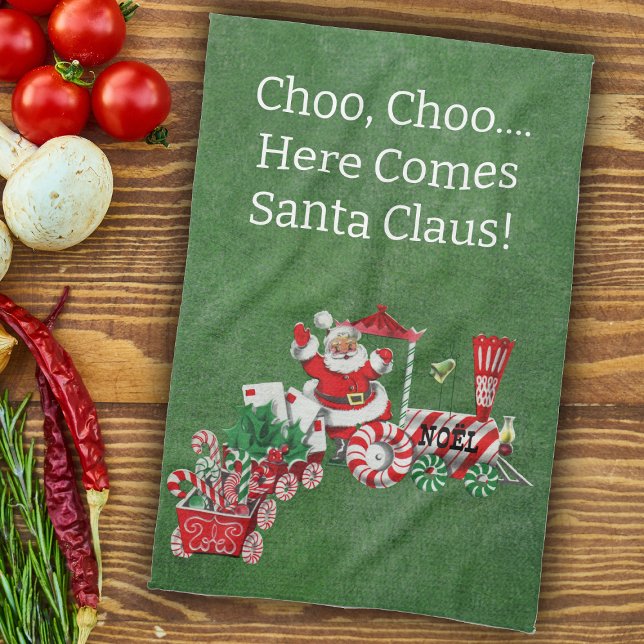 Here Comes Santa on Candy Christmas Train Green Kitchen Towel (Here come Santa riding Christmas train with candy, letters on green kitchen Chrismtas towel.)