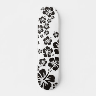 hibiscus blooms in black skateboard deck