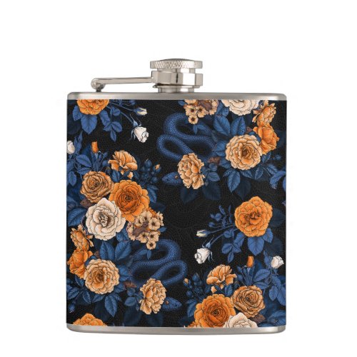 Hidden in the roses orange and blue flask