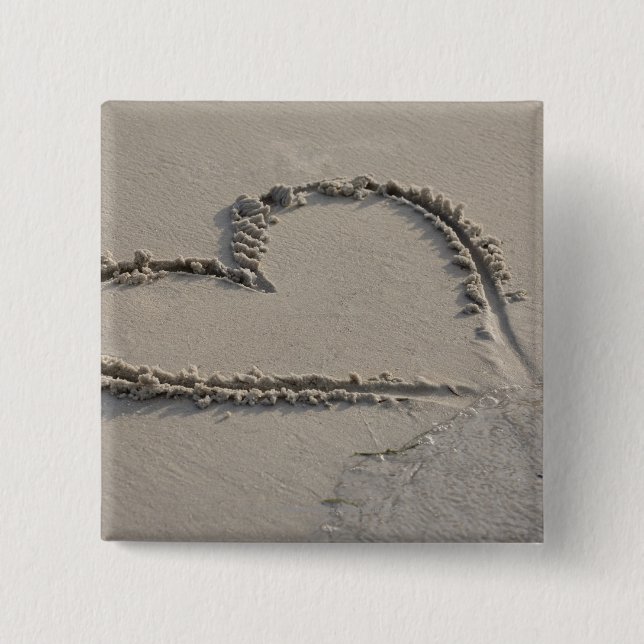 High angle view of a heart shape on the beach button (Front)