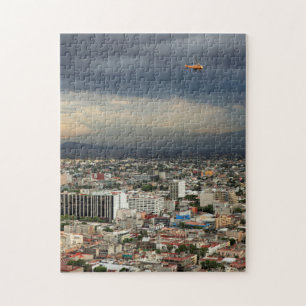 High Angle View Of Cityscape Against Cloudy Sky Jigsaw Puzzle
