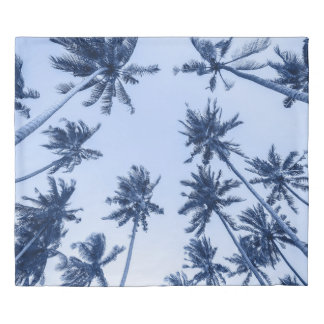 High palm trees, clear blue sky. duvet cover
