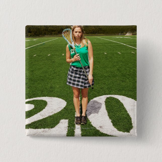 High school lacrosse player (16-18) holding pinback button (Front)