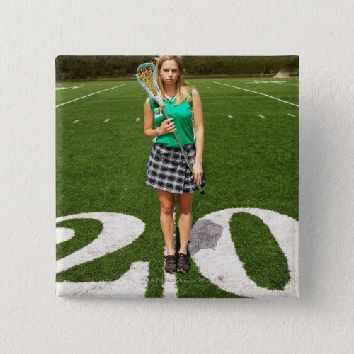 High school lacrosse player 16_18 holding pinback button