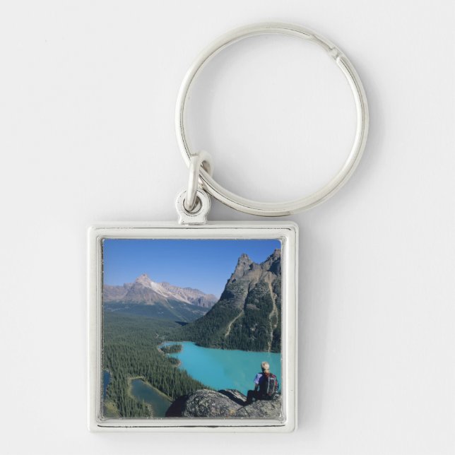 Hiker overlooking turquoise-colored Lake Keychain (Front)
