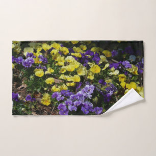 Hillside of Purple and Yellow Pansies Hand Towel