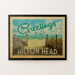Hilton Head Beach Vintage Travel Jigsaw Puzzle<br><div class="desc">This Greetings From Hilton Head vintage postcard design features a sandy beach with a beautiful turquoise ocean water and above the sea,  a blue sky with billowy white clouds. In vintage travels style.</div>