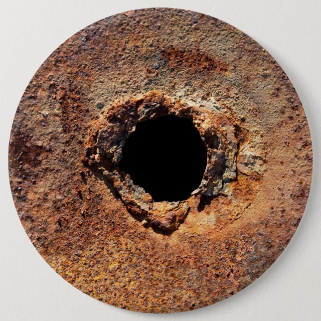 Hole in rust pinback button (Front)