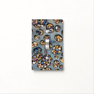 Holes filled with pebbles, CA Light Switch Cover