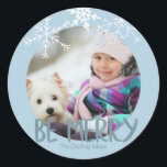 Holiday Photo Be Merry Christmas Blue Snowflakes Classic Round Sticker<br><div class="desc">The sticker has a placeholder for you to add your own photo. The typography is designed as a photo overlay and reads "Be Merry" in a modern font. You can further personalize the design by adding your family name(s). The sticker is powder blue with soft white, hand drawn snowflakes. Matching...</div>