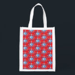Holiday red and blue snowflakes and stars reusable grocery bag<br><div class="desc">Holiday red and blue snowflakes and stars pattern. 
Need more? Check out other holiday designs at my store! Cheers! :)</div>