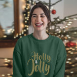 Holly Jolly Green Merry Christmas Long Sleeve T-Shirt<br><div class="desc">Get into the Christmas spirit with this cheerful women's long sleeve top. Featuring a bold "Holly Jolly" graphic print, this cozy, comfortable shirt is the perfect way to showcase your love of the holiday season. Crafted from a soft, stretchy cotton-blend fabric, this long sleeve tee offers a relaxed, flattering fit...</div>