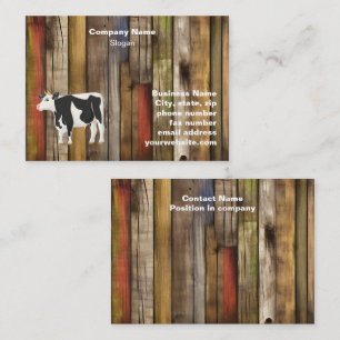 Holstein cow with old board background business card