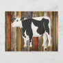 Holstein cow with old board background postcard