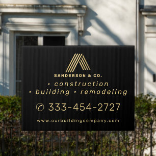 Home building construction contractor gold black sign