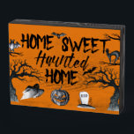 Home Sweet Haunted Home Halloween  Wooden Box Sign<br><div class="desc">Add a spooky touch to your room with this Home Sweet Haunted Home wooden display sign featuring creepy black lettering and Halloween-themed illustrations of scary trees,  bats,  a jack-o-lantern,  a ghost and a black cat all set against an orange background.</div>