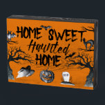 Home Sweet Haunted Home Halloween  Wooden Box Sign<br><div class="desc">Add a spooky touch to your room with this Home Sweet Haunted Home wooden display sign featuring creepy black lettering and Halloween-themed illustrations of scary trees,  bats,  a jack-o-lantern,  a ghost and a black cat all set against an orange background.</div>