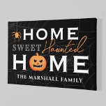 Home Sweet Haunted Home Personalized Halloween Canvas Print<br><div class="desc">Welcome your guests with this spooky fun personalized Halloween canvas wall art. The stylish typography design features "Home Sweet Haunted Home" wording with custom text for your family name and accents of a scary jack-o-lantern pumpkin, creepy dangling spider, and spider web background. Includes a black, gray, white, and orange color...</div>