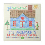Home Sweet Home Cross Stitch House Personalized Tile<br><div class="desc">This personalized country house design is made to resemble a vintage cross stitch embroidery sampler. It shows a blue house made of "x"s with a bird, the sun and plenty of hearts and flowers in the same style. The background is beige with a slight check pattern to look like embroidery...</div>