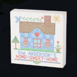 Home Sweet Home Farmhouse Cross Stitch Custom Name Wooden Box Sign<br><div class="desc">Enjoy vintage farmhouse style with this "home sweet home" faux cross stitch personalized 6"x6" wooden box sign. Made to look like an antique embroidery sampler, the design includes a blue house with a bird, the sun, a tree, a flower, and a heart in the center. To customize, use the easy...</div>