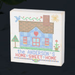 Home Sweet Home Farmhouse Cross Stitch Custom Name Wooden Box Sign<br><div class="desc">Enjoy vintage farmhouse style with this "home sweet home" faux cross stitch personalized 6"x6" wooden box sign. Made to look like an antique embroidery sampler, the design includes a blue house with a bird, the sun, a tree, a flower, and a heart in the center. To customize, use the easy...</div>