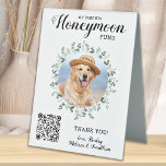 Honeymoon Fund Eucalyptus QR Code Dog Pet Wedding Table Tent Sign<br><div class="desc">Let your best dog be in charge of your honeymoon with this custom pet photo honeymoon fund sign. Perfect for dog lovers, and a dog honeymoon fund will be a hit at your wedding. Simple modern white with eucalyptus leaves. "My Parents Honeymoon Fund" Customize this pet wedding honeymoon fund sign...</div>