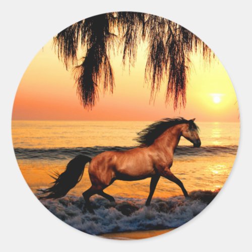 Horse on beach at sunset classic round sticker