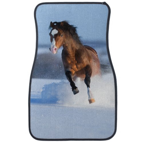 Horse running across the field in winter car mat
