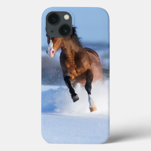 Horse running across the field in winter iPhone 13 case