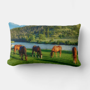 Horses Grazing Near A River And Mountain Lumbar Pillow