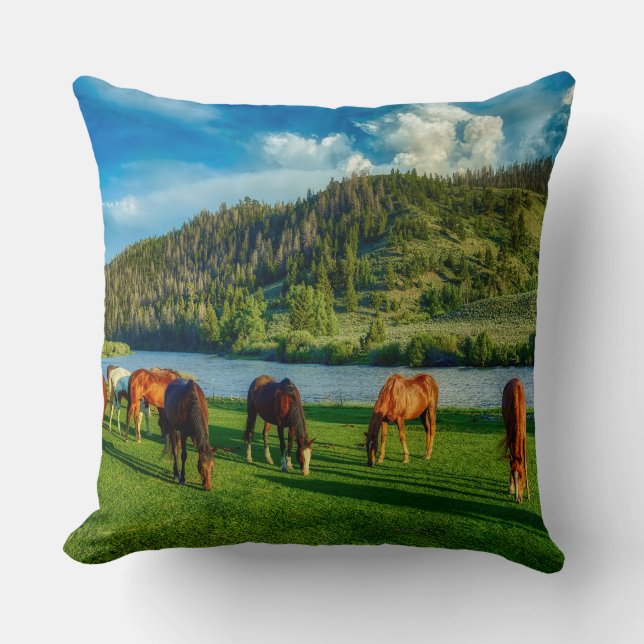 Horses Grazing Near A River And Mountain  Throw Pillow (Front)