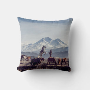 HORSES IN BROWN OPEN FIELD VIEWING MOUNTAIN AT DAY THROW PILLOW
