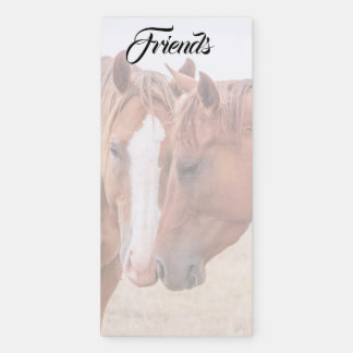 Horses nuzzling in a pasture magnetic notepad