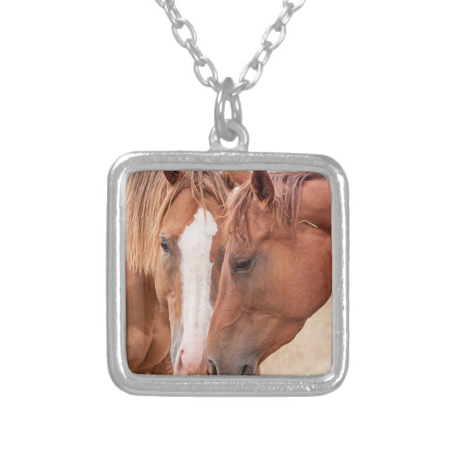 Horses nuzzling in a pasture silver plated necklace (Front)