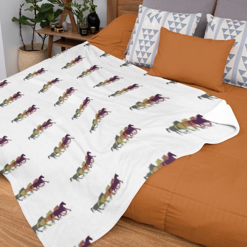 Horses running across white fleece blanket