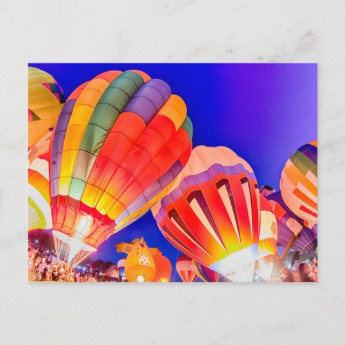 hot air balloon glow at night postcard