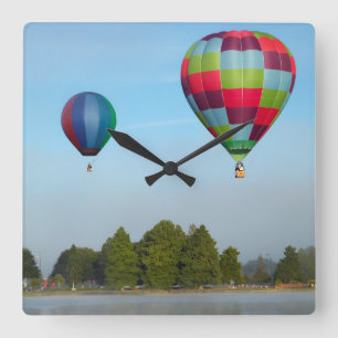 Hot air balloons over a lake, NZ Square Wall Clock