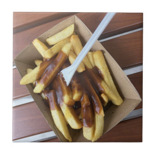 Hot chips drenched in gravy and chicken salt ceramic tile