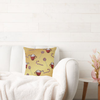 Hot chocolate and candy cane on faux golden throw pillow
