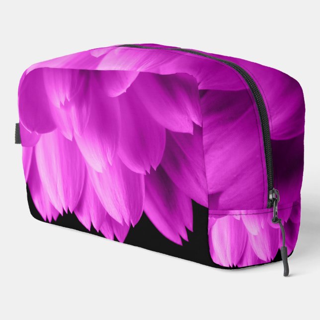 Hot pink flower petals on black dopp kit (Right Corner)