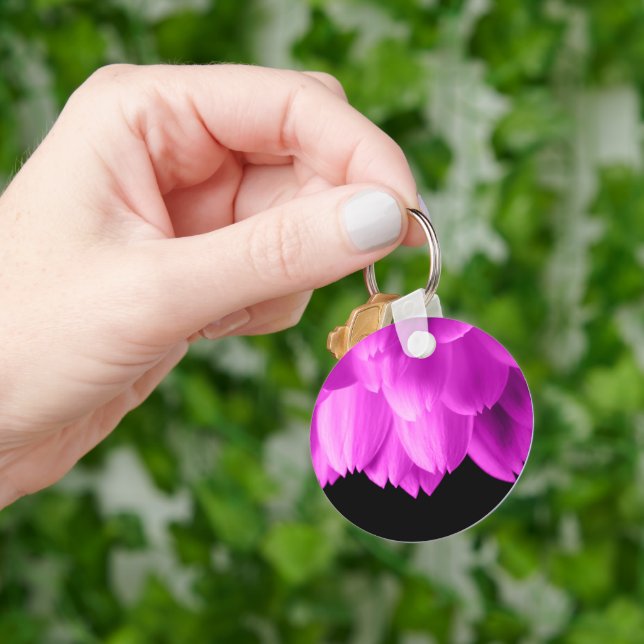 Hot pink flower petals on black keychain (Hand)