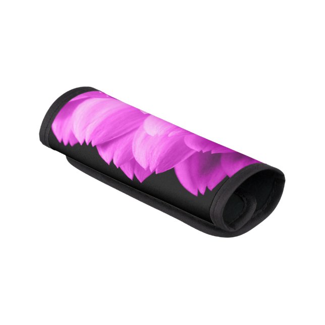Hot pink flower petals on black luggage handle wrap (Angled)
