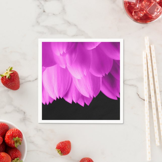 Hot pink flower petals on black napkins (Insitu)