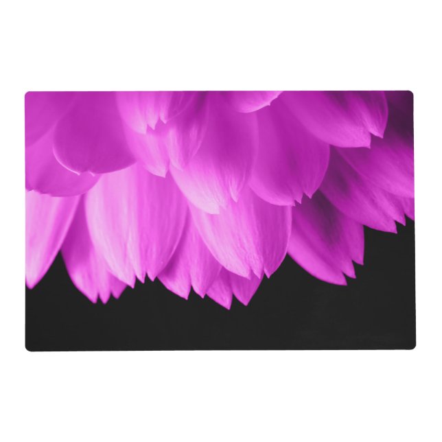 Hot pink flower petals on black placemat (Front)