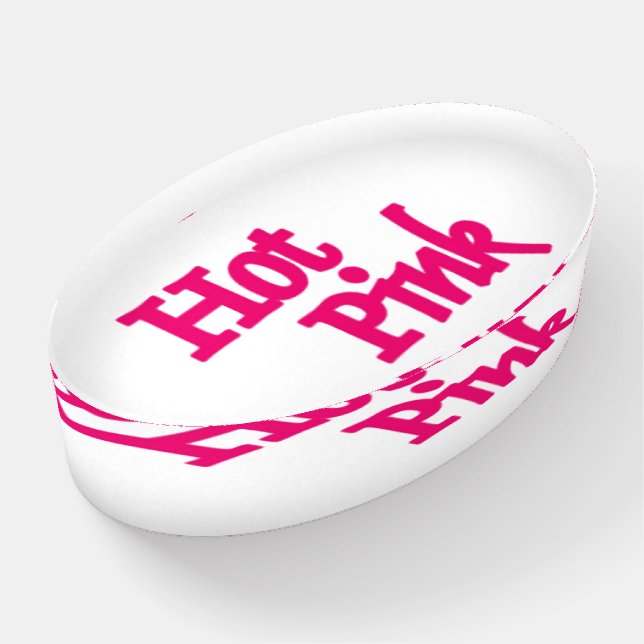 Hot Pink word white glass oval paperweight (Angled)