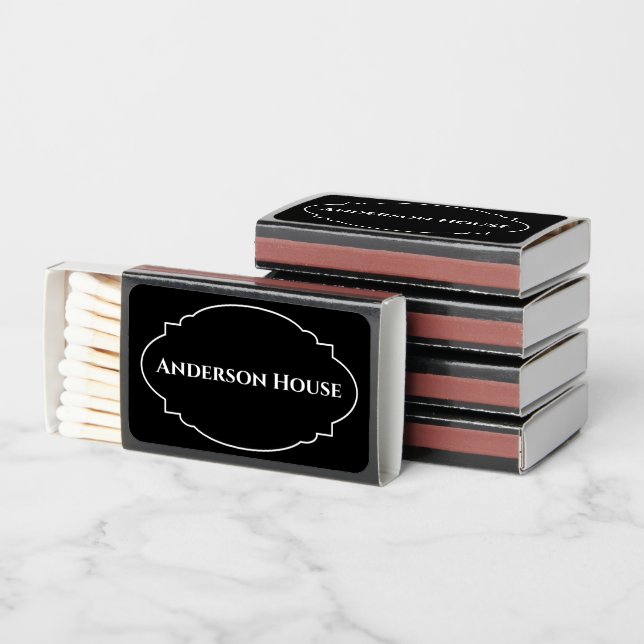 A matchbox party favor showcasing "Anderson House" merch set against four more stacked matchboxes.